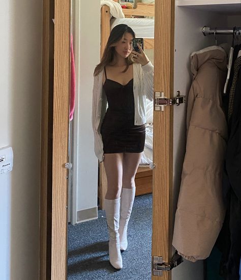 Outfits With White Heel Boots, Outfits With White Gogo Boots, White Mini Dress Winter Outfit, White's Boots Semi Dress, Mini Dress Cardigan Outfit, Black Dress With White Cardigan, White Go Go Boots Outfit, White Boots W Skits, Black Gogo Boots Outfit