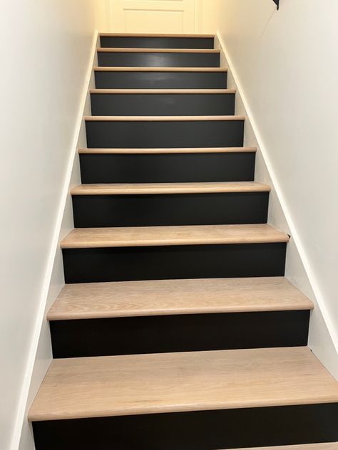 Split Level Downstairs Living Room Ideas, Black White And Wood Basement, Two Tone Wood Stairs, Stair Backing Ideas, White Room Black Ceiling, Stairs With Black Risers, Two Tone Stairs, Black Steps Stairways, Black Risers On Stairs