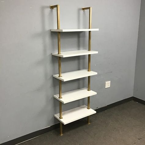 Modern, clean lines, and a touch of glam ✨ These wall mounted shelves are ready to display your favorite books and bobbles! Contemporary White Laminate & Gold Metal 5-Tier Wall-Mounted Ladder Shelf [$120 New!] (24”W x 12”D x 73”H) Item Number: 16368-7 $80 Love it? Don’t miss out! You can purchase this item on our website (link in bio). Pro Tip: use the Item Number listed above to search for this exact product. Or come by our new store location anytime at 401 Elmira Road! We always love t... Thrift Shop Finds, Interior Architecture Drawing, Love The Earth, White Laminate, Mounted Shelves, Ladder Shelf, Wall Mounted Shelves, Website Link, Green Design