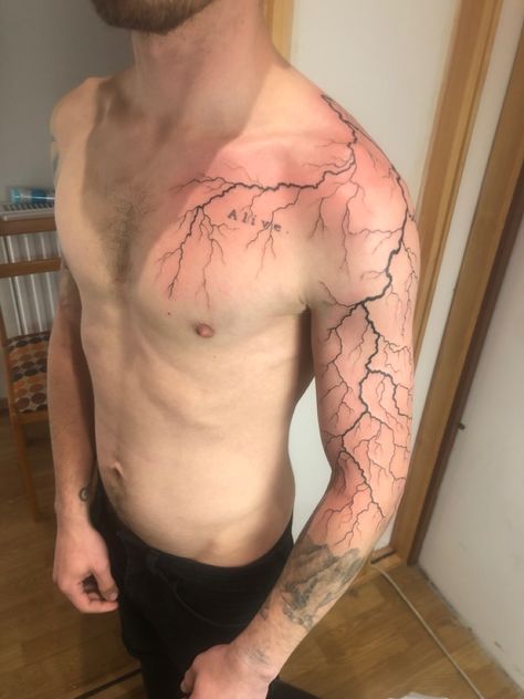 Lightning Tattoo Designs Men, Chest Lightning Tattoo, Lightning Tattoos For Men, Lighting Tattoo On Shoulder, Lighting Sleeve Tattoo, Lighting Design Tattoo, Thunder Tattoo Shoulder, Lighting Shoulder Tattoo, Lightning Sleeve Tattoo