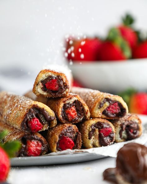 Sweet strawberries and rich chocolate hazelnut spread are stuffed inside a french toast roll up and tossed in cinnamon sugar! This festive breakfast idea is so much fun to make and so easy too! (They would be perfect for Valentine's Day, Mother's Day or even for a bridal shower brunch!) Nutella Roll Ups, Strawberry And Nutella, Festive Breakfast, Bread And Coffee, Nut Butter Cookies, Toast Roll Ups, Quick And Easy Breakfast Ideas, French Toast Roll Ups, French Toast Rolls