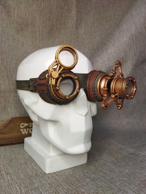 Leather steampunk goggles "Watchmaker" with clear lenses are complemented by an additional watchmaker's magnifying loupe and additional lenses. These glasses are the perfect addition to any steampunk or dieselpunk look! The glasses are made of genuine leather with 3D printed parts. *Glasses use clear lenses. Available with clear or dark lenses. (We do not use optical lenses in glasses. The lenses are made of acrylic glass.) Leather design by DiselPunk.Ro Skin color may vary slightly from image. Dieselpunk Outfit, Goggles Drawing, Rave Glasses, Aviator Goggles, Mode Steampunk, Steampunk Leather, Steampunk Goggles, Sale Ideas, Style Steampunk