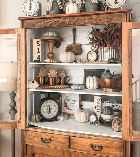 Fall Shelf Decor Ideas Kitchen, Display Cabinet Decor Living Rooms, Fall Curio Cabinet Decor, China Cabinet Fall Decor Ideas, Fall Decor Bookshelves, Fall Cabinet Decor, Fall China Cabinet Decor, Fall Ladder Shelf Decor Ideas, Fall Decor For China Cabinet