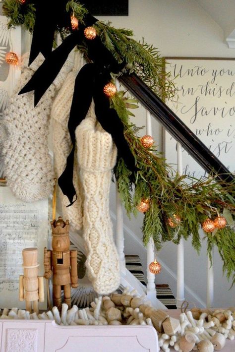 Anthropology Decor Inspiration, Christmas Decor Velvet Ribbon, Neutral And Black Christmas Decor, Stockings On Stairs With Garland, Boho Garland Christmas, Christmas Decor Inspiration Cozy, Small Staircase Christmas Decor, Black And Copper Christmas Decor, How To Hang Stockings On Stairs