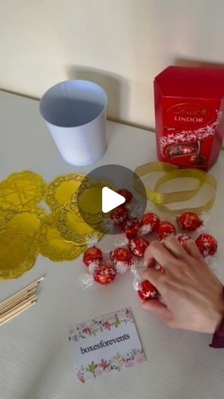 Rubbia on Instagram: "Chocolate Wedding Favours 

#chocolate #fyp #wedding #birthday #party #shadi #favours #treats #giveaways #instalike #instareels #byrubbia #lindt #lindor #paperdoilies #chocolates #chocolatetreats #weddingseason #ideas #gifts #howto #asmr #foryou" Lindor Chocolate Bouquet, Lindt Chocolate Gift Ideas Diy, Lindt Gift Ideas, Lindt Chocolate Ball Wreath, Lindt Chocolate Gift Ideas Christmas, Lindt Chocolate Wreaths, Hershey Kiss Christmas Tree, Chocolate Gift Ideas Creative, Chocolate Table Decorations