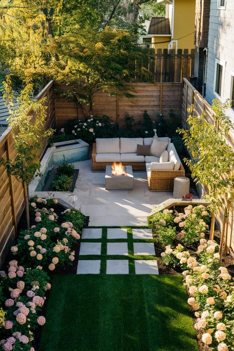 Backyard garden with a cozy seating area around a fire pit, surrounded by flowers and greenery. All Patio Backyard, Garden Ideas Small Backyard, Small Slanted Backyard Ideas, Town Home Backyard Ideas, Oasis Yard Ideas, Amazing Small Backyards, Tony Backyard Ideas, Small Backyard Retreat, Small Grass Backyard Ideas