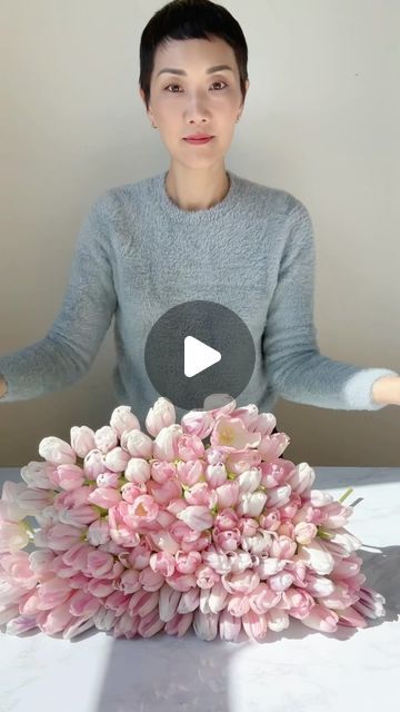 7.9K views · 1.1K likes | NYC Wedding and Events Florist on Instagram: "120 tulips in 1 vase.  Stack them neatly. Grab them carefully. Cut straight across. Tie with a clear rubber band.  Rinse. Place into a clean vase. Give it a try! 120 not necessary.   Who else is so happy it’s tulip season? #tulips #tulipseason #floristsofinstagram #floraldesign #rachelchofloral" Long Flower Table Arrangements, Tall Wedding Centerpieces Flowers, Tulip Arrangement Ideas Floral Design, Japanese Floral Arrangements, Tulip Wedding Arrangements, Flower Arrangements With Tulips, Tulip Vase Arrangement, Tulips Flower Arrangements, Tulip Bouquet Arrangement