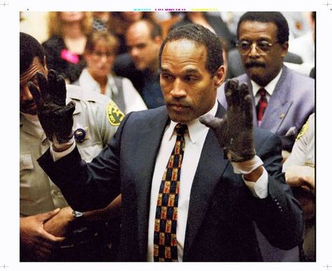 O.J. Simpson displays the gloves to the jury. "If it doesn't fit, you must acquit," defense attorney Johnnie L. Cochran Jr. told jurors O J Simpson, Oj Simpson, Robert Kardashian, Reality Shows, Bill Clinton, Mike Tyson, Reality Tv Shows, Ex Wives, Ford Bronco