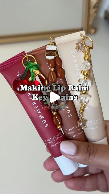 Aman on Instagram: "Making my favorite lip balms into key chains✨  @summerfridays   Which one is your favorite?   inspo: @j.xnah 🫶🏽 #lipbalm #summerfridays #lipbutter #lipbalmkeychain #diy" Lipgloss Holder Keychain Diy, Chapstick Keychain Diy, Lip Balm Charms Diy, Lip Balm Keychain Aesthetic, Diy Lip Gloss Keychain, Summer Fridays Lip Balm Keychain, Lipgloss Charms Diy, Lipgloss Keychain Diy, Lip Gloss Charm Diy