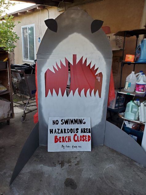 Diy Cardboard cutout of shark. Inspired by jaws movie. Jaws Homecoming Float, Jaws Decorations, Jaws Halloween, Jaws Pool Party, Shark Door Decoration, Shark Photo Booth Diy, Wall Shark Cardboard, Shark Diy, Hoco Decor