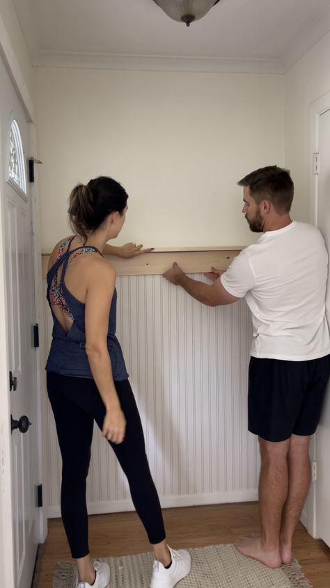 Beadboard Wallpaper Entryway, Narrow Entryway Mudroom, Small Entryway Behind Door, Small Entryway Paneling, Entry Hooks Decor, Indoor Front Door Decor, Wainscoting Entryway Hooks, Feature Wall In Hallway, Pole Wrap Entryway