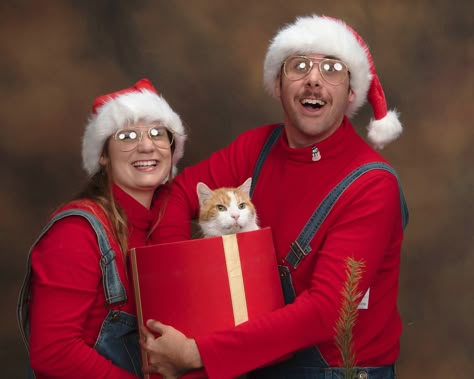 My wife and I recently had out Christmas photos done...We even borrowed a cat for extra cringe. Cat Family Christmas Cards, Christmas Pictures With Cats Family Photos, Couples Holiday Cards, 90s Christmas Pictures, Cheesy Family Christmas Photos, 90s Christmas Card Photo, Family Christmas Pictures With Cat, Funny Cat Christmas Cards Family Photos, Christmas Card Ideas With Cats