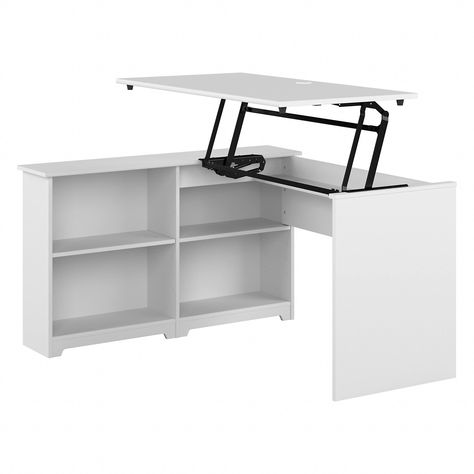 PRICES MAY VARY. 52W x 47D x 30H 3 Position Sit to Stand Corner Desk boasts transitional styling that suits a variety of home offices Lift-n-lock desktop smoothly and securely adjusts to three heights: 37, 40, or 42 inches from the floor Work surface supports up to 20 pounds when raised to any of the three standing desk height settings Built-in shelves are perfect for organizing a small collection of books, home office supplies and more Ergonomic desk's center shelves can be raised or lowered to Corner Desk With Shelves, Ergonomic Home Office, Transitional Desks, Standing Desk Height, Desk With Shelves, Ergonomic Desk, Bookshelf Desk, Sales Desk, Sit To Stand