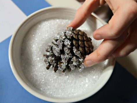 How to Make a Stunning Woodland Table Decoration • Craft Invaders Woodland Christmas Table Centerpiece, Pine Cone Christmas Table Centrepiece, Birch Log Centerpiece Christmas, Nature Christmas Table Decor, Woodland Craft Ideas, Decorated Pine Cones, Woodland Christmas Table Decor, Woodland Christmas Centerpiece, Woodland Table Centerpieces