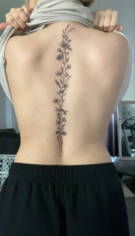 Sunflower Vine Tattoos For Women, Simply Spine Tattoo, Curvy Spine Tattoo, Cosmos Spine Tattoo, Spinal Tattoo Floral, Daisy Chain Spine Tattoo, Floral Tattoo Design Spine, Simple Flower Spine Tattoos For Women, Floral Spine Tattoo With Quote