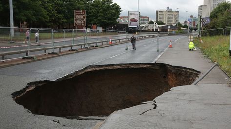 What Are Sinkholes and How Do They Work? Dramatic Photos, Manchester City Centre, Natural Pond, Nature Of God, Sink Design, City Centre, Natural Disasters, Manchester City, Nature Pictures