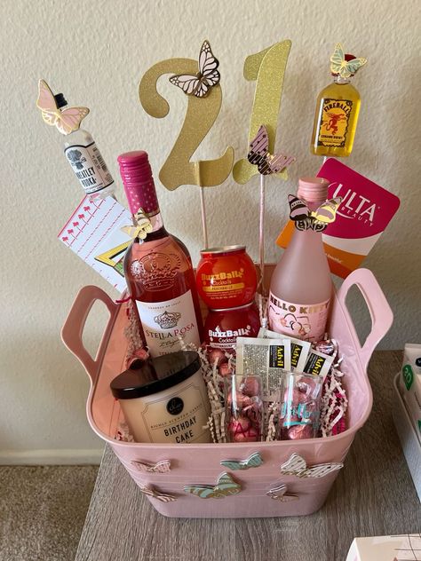 21st Birthday Gift Baskets: 25+ Unique & Thoughtful Ideas. Check it out! 18th Gift Basket, Sister 21st Birthday Gift, 21 Bday Basket, Birthday Basket For Grandma, 21st Gift Basket Ideas, 21 Birthday Gift Basket, Gift Basket For Sister Birthday, Diy 21st Birthday Gifts For Her Baskets, Gift Card Basket Ideas Birthday