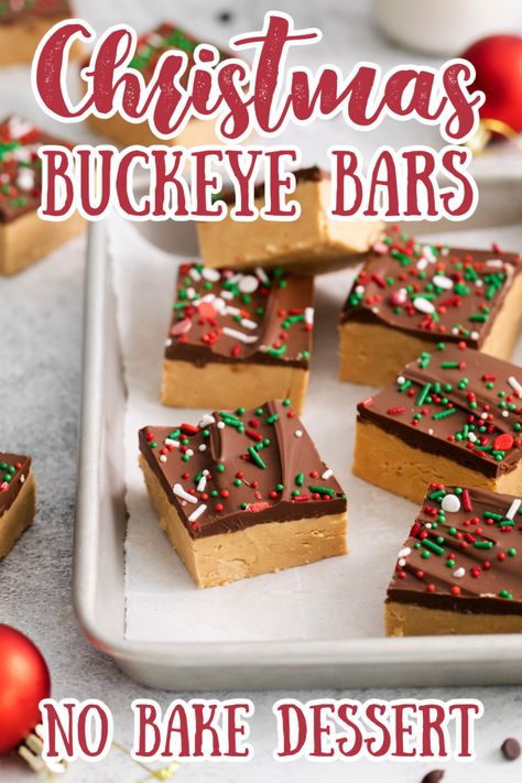 If you’re looking for a buckeye recipe that doesn’t require hours of rolling and dipping, you’ve come to the right place! These bars have a sweet, crumbly peanut butter layer and are topped with rich chocolate– but the best part is they only take a few minutes of prep work! Buckeye Bars Recipe | No Bake Dessert Recipe | Christmas Desserts | No Bake Christmas Desserts #christmas #dessert #chocolate No Bake Buckeye Bars Recipe, Christmas Chocolate Chip Cookie Bars, Christmas Peanut Butter Desserts, Christmas Desserts Peanut Butter, Holiday Dessert Bars Christmas, Christmas Peanut Butter Fudge, No Bake Peanut Butter Blossoms, Peanut Butter Christmas Desserts, No Bake Desserts For Christmas