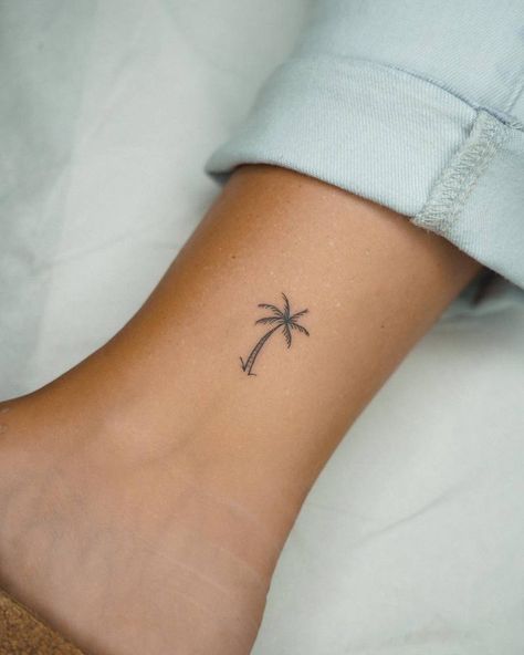 Little minimalistic palm tree tattoo located on the Small Aloha Tattoo, Small Holiday Tattoos For Women, Tiny Tattoos Palm Tree, Palm Tattoo Minimalist, Palm Tree On Ankle, Small Tattoo Palm Tree, Palm Tree Tattoo Dainty, Tattoo Ideas Female Palm Tree, Palm Tree Tattoo Line Work