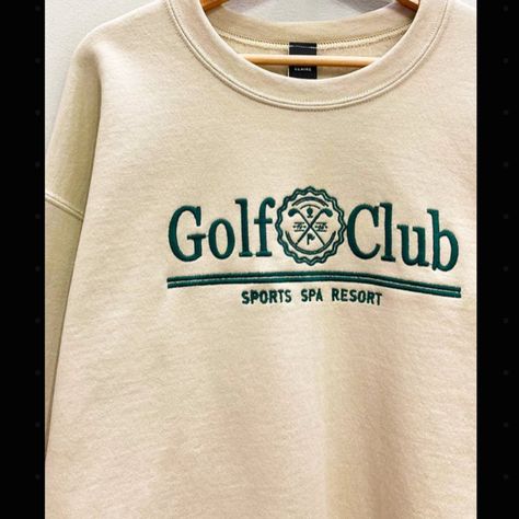 This Embroidered Golf Club Sweatshirt Features A Classic And Oversized Design, Providing Both Style And Comfort On The Course. Made For All Golf Lovers Of All, The Sweatshirt Allows For Unrestricted Movement And Keeps You Warm On Those Chillier Days. Stand Out On The Green With This Timeless Piece. 50% Cotton 50% Polyester Photos Have Been Edited To Enhance Color Warm Taupe, Club Sweatshirts, Flannel Tops, Graphic Tops, Loungewear Sets, Embroidered Sweatshirts, Oversized Sweatshirt, Sweatshirt Designs, Embroidered Design