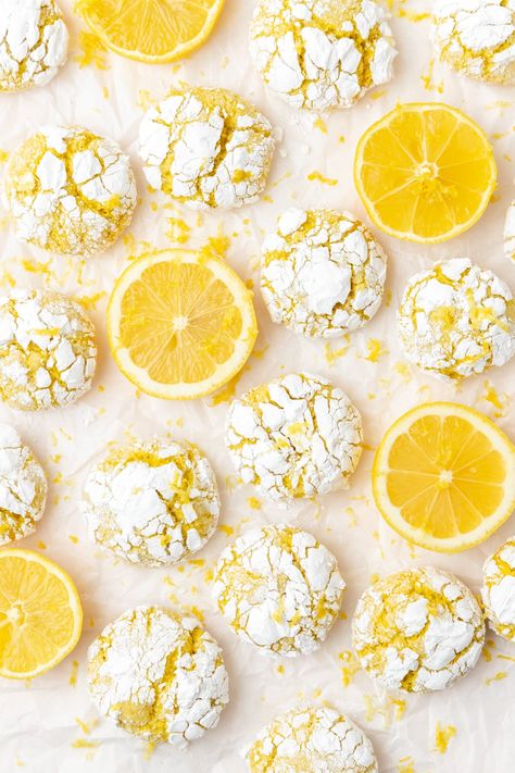 These lemon crinkle cookies are a fun twist on classic chocolate crinkles! With crispy edges and soft lemony centers, they're an easy, fun summer cookie that everyone will love! New Year Desserts Ideas, Lemon Crinkle Cookies Recipe, Snowball Cookie, Summer Corn Chowder, Pink Sangria, Summer Cookie, Christmas Baking Gifts, Berry Sangria, Lemon Crinkle Cookies