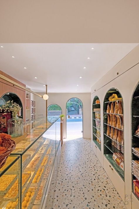 A Confectionery Store With Linear Language And Striking Material | The Plot Studio - The Architects Diary Sweet Shop Design Interiors, Namkeen Shop Interior Design, Dairy Shop Interior Design, Mithai Shop Interior Design, Sweet Shop Interior Design Indian, Sweet Shop Interior Design, Sweet Shop Interior, Indian Sweet Shop, Shop Board Design