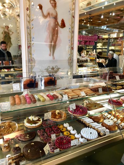 A third historic institution of the marketplace is Pâtisserie Stohrer, which has been making pastries since 1730 (making it the oldest pâtisserie in Paris)! It was founded by Nicolas Stohrer, the Polish baker for Marie Leszczynska who was the daughter of King Stanislas of Poland and who married into the French court via Louis XV. He was brought along by the new queen so that she could continue to enjoy his pastries. Today, we can enjoy them too. Stohrer offers his original creation “baba au rhum Patisserie, Stohrer Paris, Making Pastries, Paris Pastries, Bakery In Paris, Petite Fours, Daughter Of King, Maid Cafe, Versailles Garden