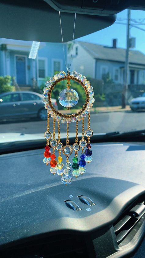 Decorate your space with this beautiful bright Rainbow Crystal  car charm sun catcher with beautiful crystal beads, and a crystal prism that reflects rainbows in direct sunlight. 🌞🌈 ✨Handmade with love! Add some positive energy to your car's rear view mirror or any small space like your kitchen or bathroom window. Perfect for tiny homes and van lifers too! Makes the perfect gift for anyone and everyone who loves all things that sparkle and shine!  ✨thank you for supporting my small business! I Van Lifers, Crystal Suncatchers Diy, Crystal Car Charms, Rainbow Car, Seed Bead Bracelets Tutorials, Suncatcher Diy, Car Charms Rear View Mirror, Diy Suncatchers, Dream Catcher Craft