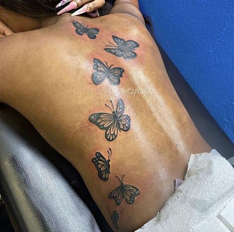 Butterflies Down Back Tattoo, Butterfly Tattoo Going Down Back, Butterflies On The Back Tattoo, Butterfly Going Up Back Tattoo, Tattoo Ideas Butterfly Back, Tattoo Ideas Female Back Butterfly, Butterfly Spin Tattoo, Colored Butterfly Tattoo Black Women, Back Tattoo Women Butterflies