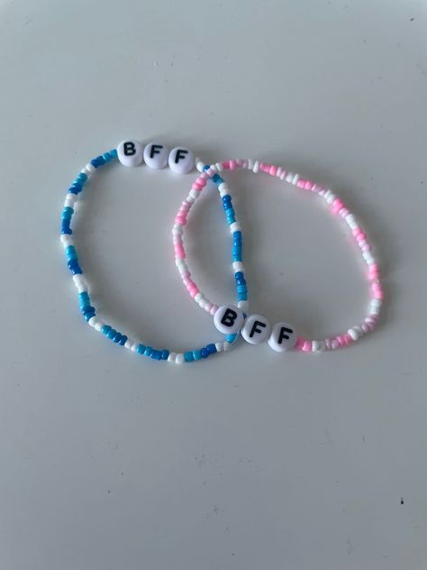 blue and pink matching 2mm seed bead BFF bracelets!! Clay Bead Bracelet Ideas School, Bff Beads Bracelet, Matching Bracelets For Best Friends Clay Beads, Clay Bead Bracelet Ideas Matching Bff, Bff Bead Bracelets, Bracelet Seed Beads Ideas, Cute Friendship Bracelets Beads, Bluey Bracelet Ideas, Matching Beads Bracelets