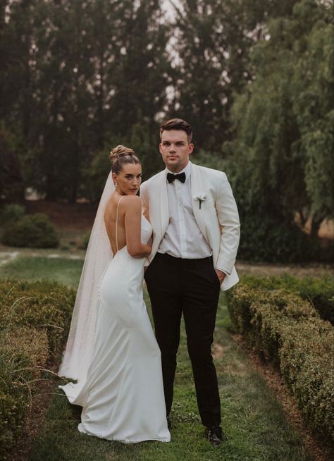 Black and white wedding simple wedding dress black and ivory tux White Tux Black Shirt, White Tux Black Pants, Groom White Jacket Black Pants, Groom White Suit Wedding, Black And White Wedding Groom, White Tux Jacket Black Pants Groom, White And Black Tuxedo Wedding, Black And White Wedding Suit, White Groom Tuxedo