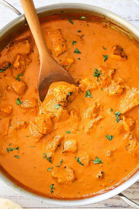 An overhead view of a large silver saucepan filled with creamy chicken tikka masala with a wooden spoon resting in the sauce. Gluten Free Chicken, Yogurt Marinade, Perfect Chicken, Ginger Sauce, Chicken Tikka Masala, Chicken Tikka, Tikka Masala, Butter Sauce, Evening Meals