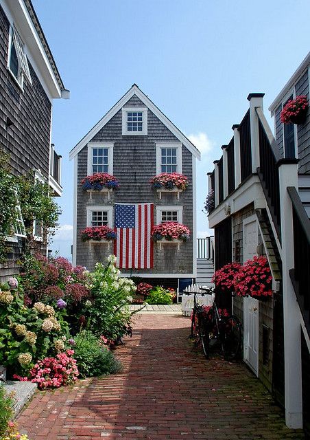 a beach house is not complete without lots of flowers and a big flag Weekend Humor, Cap Ferret, To Infinity And Beyond, Beach Cottages, Oh The Places Youll Go, Coastal Living, Nantucket, Cape Cod, Vacation Spots