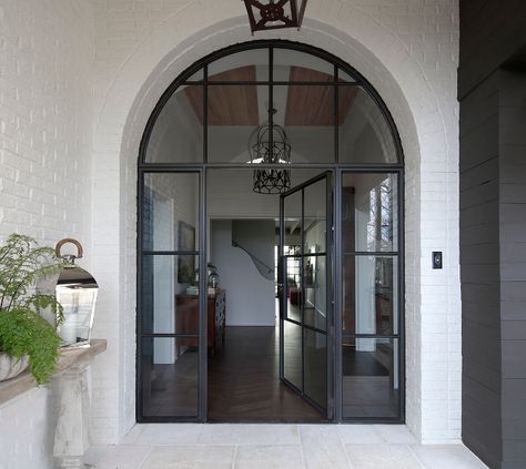 Black Steel Front Door. Arched Black Steel Front Door. Black Steel Front Door and sidelights #BlackSteelFrontDoor #BlackSteelDoor Christopher Architecture & Interiors Campinas, Arched Front Door, Metal Front Door, Steel Front Door, Steel Door Design, Front Door Entrance, Brick Exterior House, Arched Doors, Glass Front Door