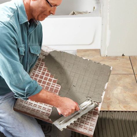 10 Common Tiling Mistakes—And How to Avoid Them Laying Tile, How To Tile, How To Lay Tile, Tile Repair, Elegant Tiles, The Family Handyman, Large Tile, Tile Saw, Modern Tiles