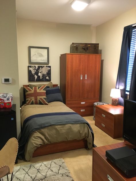 My son's dorm. Guys dorm, Union Jack, Restoration Hardware bedding, map, vintage military chest, Guy Bedroom Aesthetic Vintage, Astetic Men’s Room, Aesthetic Men’s College Dorm Room, Military Room Ideas, Military Themed Bedroom, Military Bedroom Ideas, Dorm Room Chairs, Military Bedroom, Small Room Setup