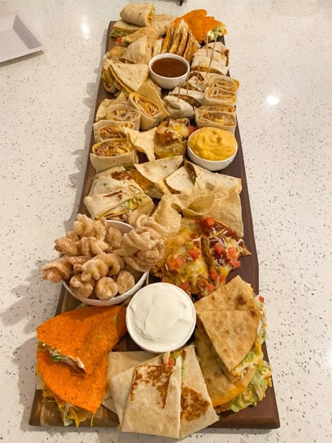 For the Taco Bell lovers... enjoy the menu on a charcuterie board so you can get a little bit of everything. #tacobell #charcuterie Taco Bell Board Ideas, Charcuterie Board Mcdonalds, Taco Bell Charcuterie Board Ideas, Empanada Charcuterie Board, Charcuterie Board Fast Food, Taco Bell Board, Charcuterie Board Nachos, Taco Bell At Wedding, Fast Food Charcuterie Board Ideas