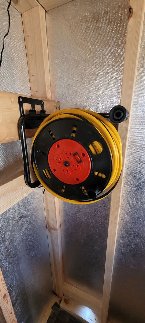 Running power to my shed with a 100ft 12/3 yellow jacket extension cord and cord reel. (bought separately) bought extension cord from Sam's club and the reel from Amazon. Electric Cord Storage Ideas, Extension Cord Storage Diy, Extension Cord Storage, Woodwork Workshop, Extension Cord Reel, Workshop Shed, Cord Storage, Hand Crank, Yellow Jacket