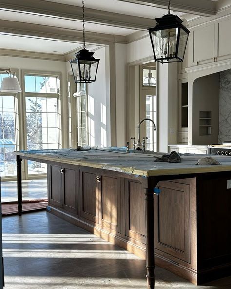 Steve Tiek | Tiek Design Group on Instagram: “Morning sun spilling into our #NewEnglandTudor ☀️. We were strategic about capturing morning sun through the entire main floor living…” Grace Stoffer Design, Kitchen Islands With Leg Supports, Steve Tiek Design, Off Center Sink In Island, Island With Bookshelf On End, Kitchen Behind Living Room, Range In Kitchen Island, Kitchen Sink Island, Rounded Island