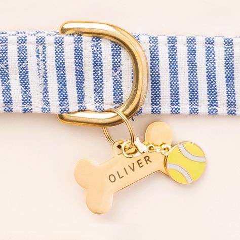 Your best fur-iend has a lot of personality, so why not show it off with a “charm”-ing collar accessory? Double-sided and made of durable enamel, this tennis ball charm is perfect for dogs who love playing catch. Easily attaches to the D ring of your dog’s collar with either the split ring or lobster clasp (both included) Charm is double-sided so the design shows in all directions Hard enamel design is extra durable with a special coating to prevent chipping and scratches Cool Dog Collars, Dog Tags For Dogs, Dog Brand, The Foggy Dog, Collar Accessory, Bandana Bow, Grand Millennial, Cute Dog Collars, Old Pillows