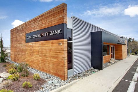 From Burger King to bank.  We stripped the abandoned fast-food building down to the slab and worked off of the existing footprint.  This high-end branch intr... Mid Century Modern Commercial Buildings, Metal Building Designs, Retail Facade, Retail Architecture, Factory Architecture, Wood Facade, Prototype Design, Bank Design, Wood Architecture