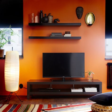 Orange and blackish/brown. i love it. LACK black-brown TV bench and wall… Tv Console Decorating, Decorating Around A Tv, Decor Around Tv, Bedroom Tv Stand, Tv Wall Decor Ideas, Ikea Tv, Flat Screen Tv, Living Room Orange, Tv Wall Decor