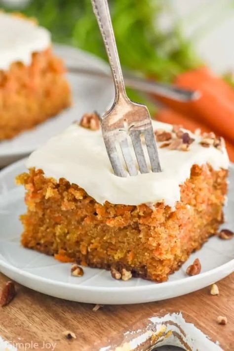 This easy Carrot Cake recipe is moist, full of great spices and flavors, and topped with the best cream cheese frosting and chopped pecans, making it an irresistible homemade cake. If you are looking for the perfect carrot cake recipe from scratch, this is it! Carrot Cake Recipe From Scratch, Carrot Cake Bars, Carrot Cake Recipe Easy, Homemade Carrot Cake, Moist Carrot Cakes, Easy Carrot Cake, Best Carrot Cake, Cinnamon Roll Cake, Sheet Cake Recipes