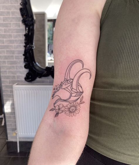 Marvel Tattoos With Flowers, Dainty Marvel Tattoos, Loki And Thor Tattoo, Simple Loki Tattoo, Feminine Marvel Tattoo, Marvel Tattoos Minimalist Wanda, Loki Helmet Tattoo, Loki Tattoos, Loki Tattoo Ideas