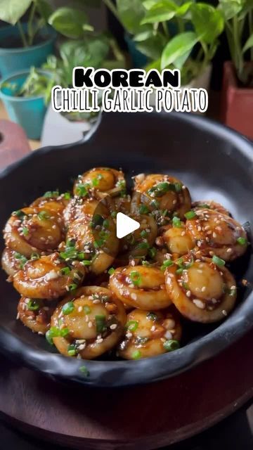 Asian Food | Recipes | Cooking on Instagram: "Korean Chilli Garlic Potatoes✨️⁣ 🎥 & recipe by @myflavourfuljourney ©️⁣ ⁣ ➡️ Follow @asianfoodsdaily for more asian meal inspo!👌⁣ ⁣ ✅Recipe details below 👇⁣ ⁣ Boil 3 medium sized potatoes⁣ Then mash them very well⁣ Now add 1/2 cup cornflour/potato starch⁣ Knead the dough very well⁣ Now make small round balls and give mushroom liked shape with bottle⁣ Now boil them for 2-3 minutes until they float on top of the water⁣ Immediately transfer them into ice cold water⁣ ⁣ For the sauce add lot of chopped garlic,chopped spring onions,red chilli powder,soy sauce,sesame seeds in a bowl and pour some hot oil⁣ Mix the sauce and add potato buttons⁣ Toss them nicely in the sauce⁣ Garnish with some more spring onions and sesame seeds on top⁣ And Enjoy!⁣ ⁣ Soy Sauce Potatoes, Korean Mashed Potatoes, Korean Potato Recipes, Chilli Potato Recipes, Jacked Potatoes, Boiled Potatoes Recipe, Potato Mushroom Recipe, Garlic Potatoes Recipe, Potato Balls Recipe