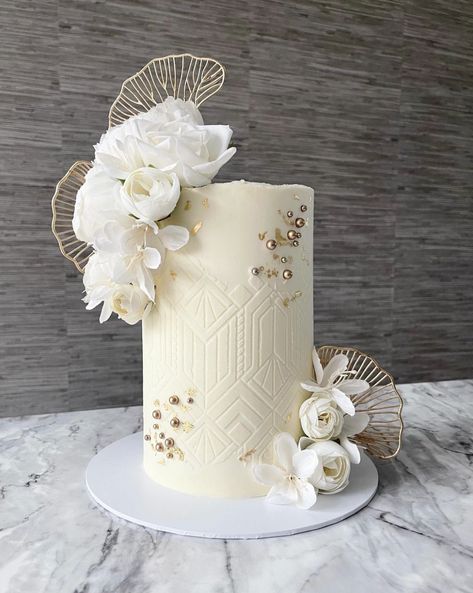 Elegant White Cakes, Tall One Tier Wedding Cake, Gold Tier Cake, Cake With White Roses, White And Gold Engagement Cake, Stencilled Cake, White Stencil Cake, Engagement Cake White And Gold, Stencil Wedding Cake Designs