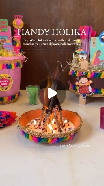 Casah 1775 | Luxury Gifting on Instagram: "Keeping traditions alive, Casa 1775 is here with yet another unique gifting experience! 🌈  Introducing our Handy Holika Candles made with soy wax and real mango wood, will make sure you can celebrate Holi from any part of the world! 💕  Reach out to us for all your gifting needs! 🥂  📲 Casa 1775 📞 +7066607864 💌 casa1775official@gmail.com . . . . . . . . [ Holi, colourful, hampers, gifts, festival of colours, india, budget friendly gifts, holi party, nagpur, Indian culture, gulaal, thandai, rang, unique, ideas, diy]" Holi Decorations Ideas At Home Diy, Holi Gift Ideas, Holi Gift Hamper Ideas, Lohri Celebration Ideas, Holi Hampers, Holi Theme, Handmade Hamper, Holi Gift, Festival Of Colours