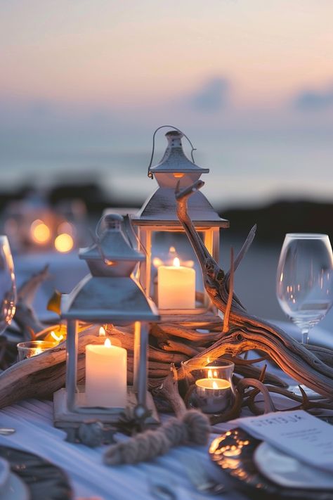 Capture the essence of love with these breathtaking wedding centerpieces. A blend of rustic driftwood and luminous lanterns create an unforgettable seaside ambiance 🌊🕯️. Perfect for brides dreaming of a beach-themed celebration 🏖️✨. #WeddingInspiration #BeachWedding #RomanticDecor #LanternCenterpieces #DriftwoodDecor #WeddingIdeas #Tablescapes #EveningGlow Seashell Bouquet, Nautical Candles, Driftwood Centerpiece, Candle Arrangements, Enchanting Wedding, Lantern Centerpieces, Enchanted Wedding, Centerpiece Wedding, Wedding Lanterns