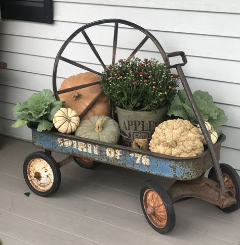 Red Wagon Decor Front Porches, Vintage Wagon Decor, Wagon Porch Decor, Store Front Decorating Ideas, Wheelbarrow Yard Decor, August Porch Decorating Ideas, Antique Porch Decor, Radio Flyer Wagon Ideas Front Porches, Wagon Garden Ideas