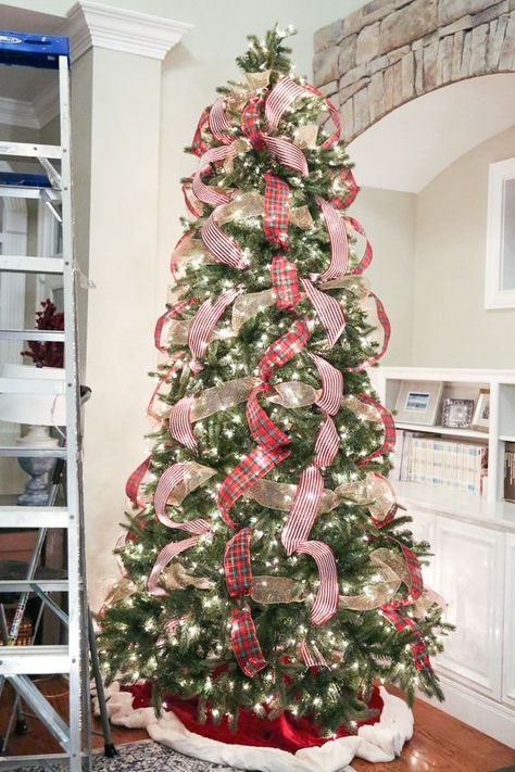 Christmas tree tip/trick/hack: How to decorate a Christmas tree with ribbon...step by step Natal, Ribbon On Christmas Tree Waterfall, Christmas Tree Vertical Ribbon, Waterfall Ribbon On Christmas Tree, Waterfall Christmas Tree Ribbon, Ribbon Only Christmas Tree, Spiral Ribbon On Christmas Tree, Red Ribbon Christmas Tree Ideas, Hanging Ribbon On Christmas Tree